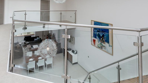 Each town house features an open-plan interior with a light-filled double height atrium.
