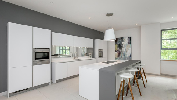 Each town house features an open-plan interior with a light-filled double height atrium.