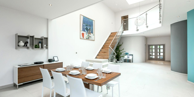 Flowing open-plan interiors offer a blend of cutting-edge design with warm, practical family living.