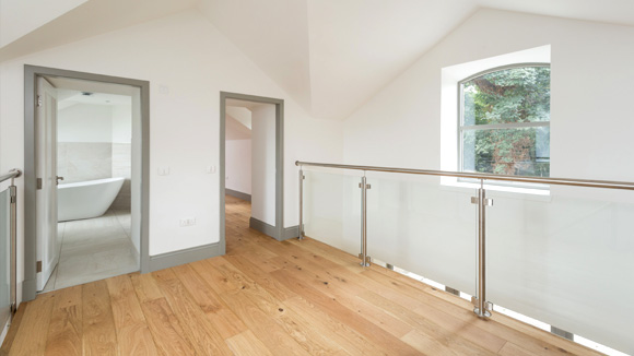 The star shaped ceiling follows the lines of the original beams in the double-height entrance hall.
