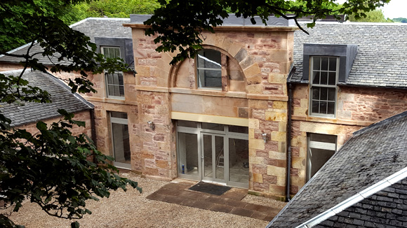 The finished building makes the most of its courtyard setting with its large double garage.