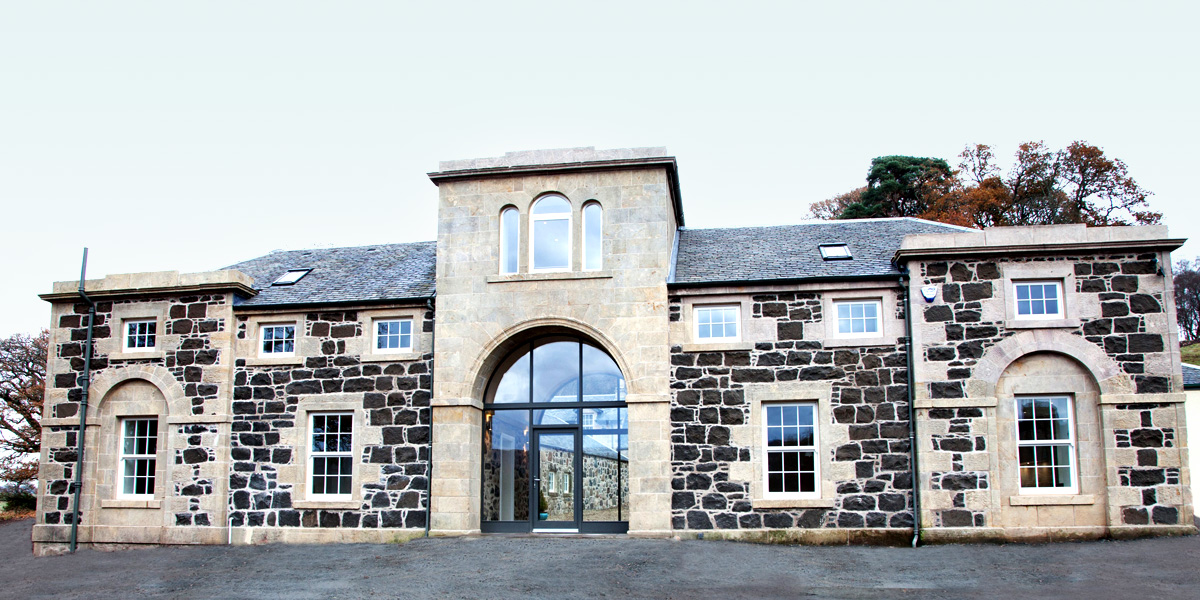 Gartur Stable - a Georgian Stable conversion featuring a glass arched entrance hallway.