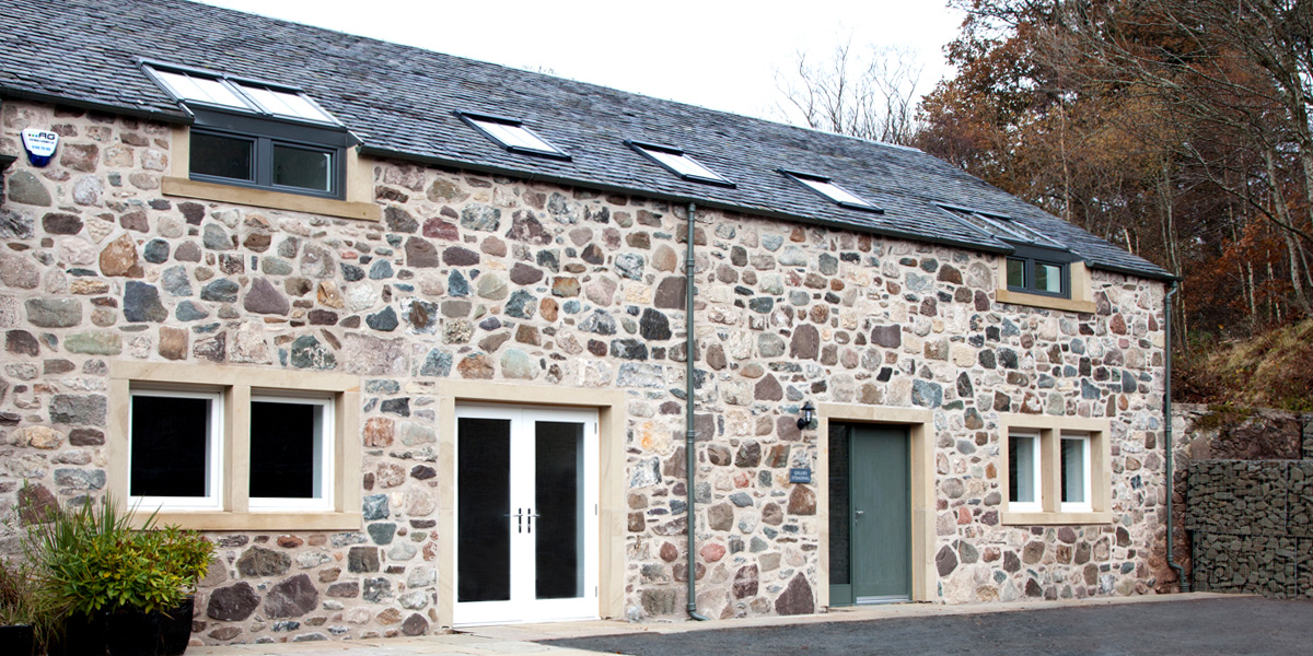 Newly built steading clad with original stone salvaged on site. Newly built steading clad with original stone salvaged on site.